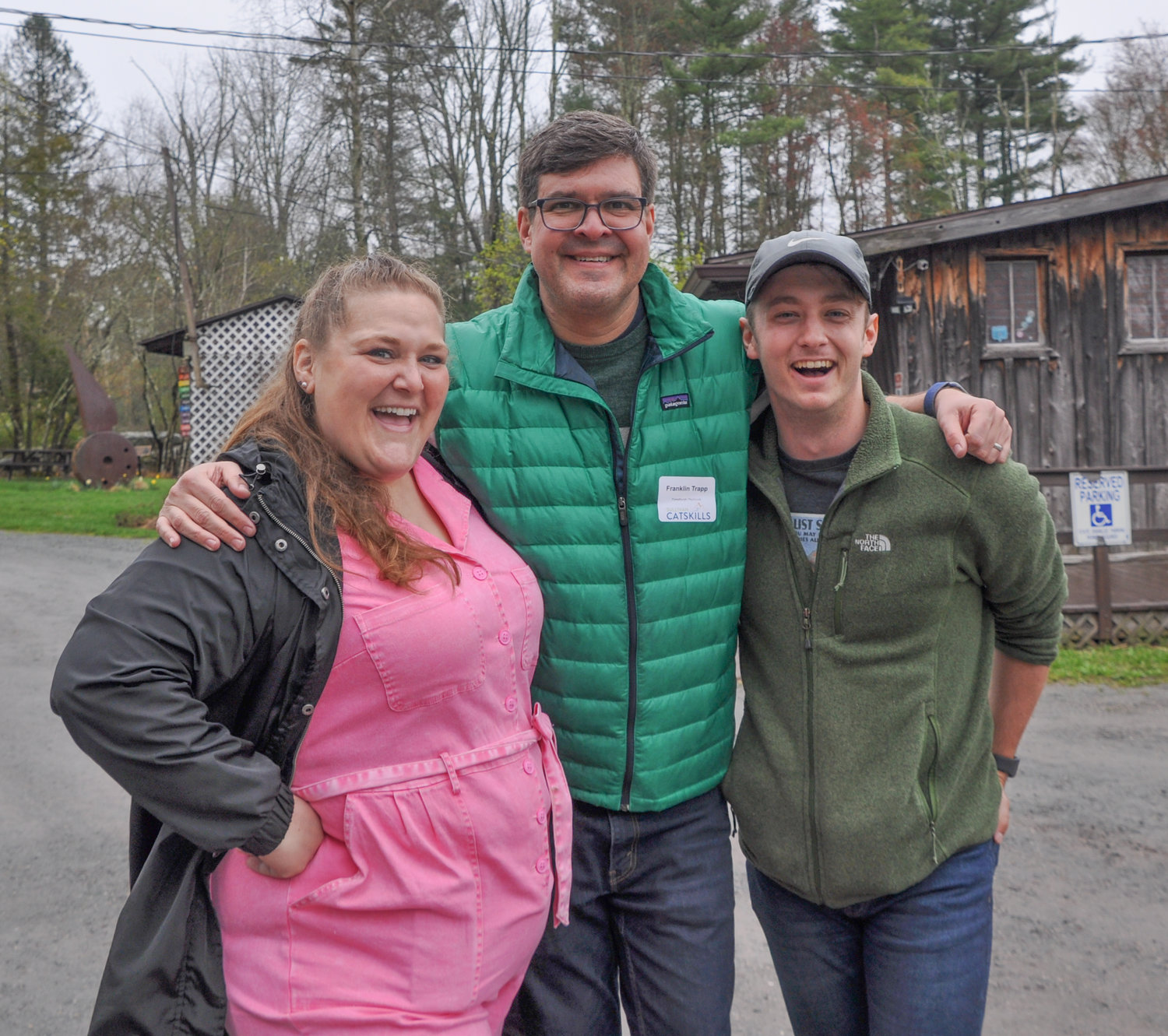 Flanked by associate producers Caitlin Kellermeyer and Benjamin Sears, Forestburgh Playhouse producer Franklin Trapp welcomed everyone to the annual Sullivan Catskills Visitors Association business-to-business rack card exchange event. It was held in the lot of the Forestburgh Playhouse last Wednesday.